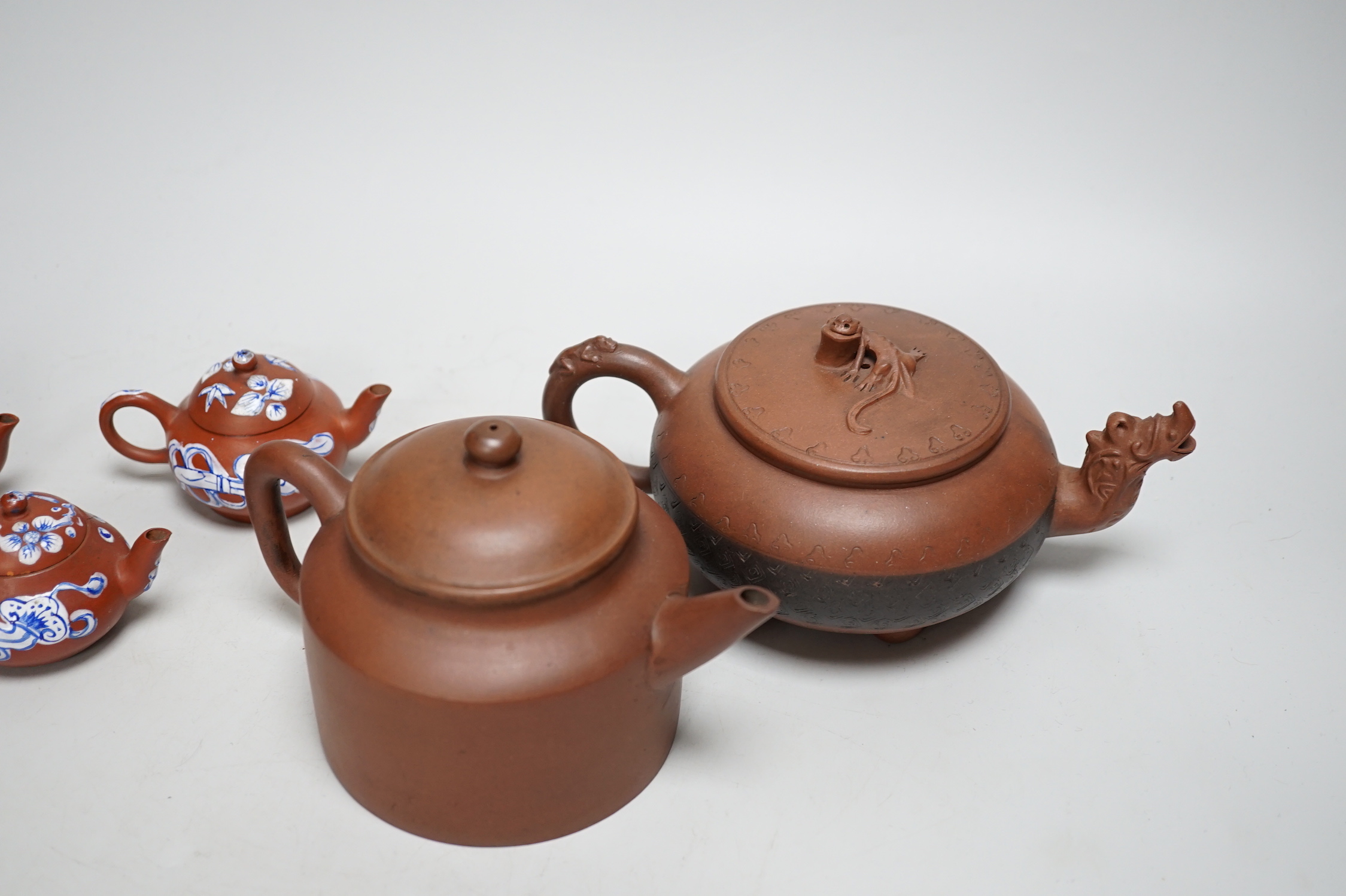 Five early 20th century Chinese Yixing teapots, widest 20cm